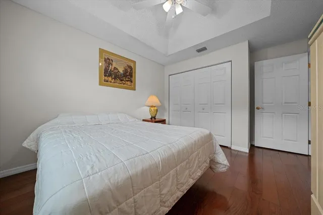 a bed room with a bed and a chandelier