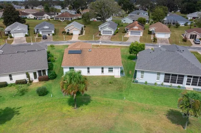 a front view of house with yard and outdoor seating