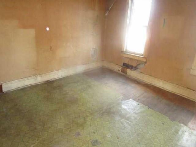 314 1/2 Lowell Street Vandergrift, PA 15690 - Photo 3 of 8 an empty room with a window