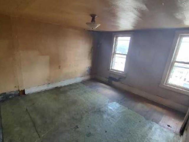 314 1/2 Lowell Street Vandergrift, PA 15690 - Photo 7 of 8 an empty room with windows