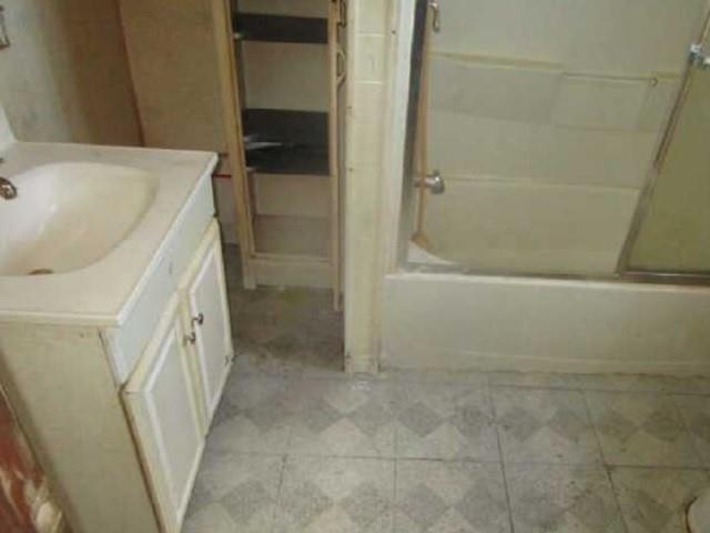 314 1/2 Lowell Street Vandergrift, PA 15690 - Photo 8 of 8 a bathroom with a tub sink and a shower