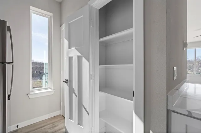 a bathroom with a bathtub and staircase
