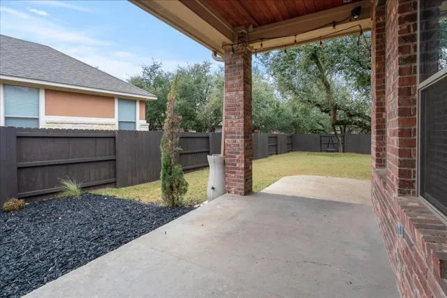 a view of a house with a small yard and plants