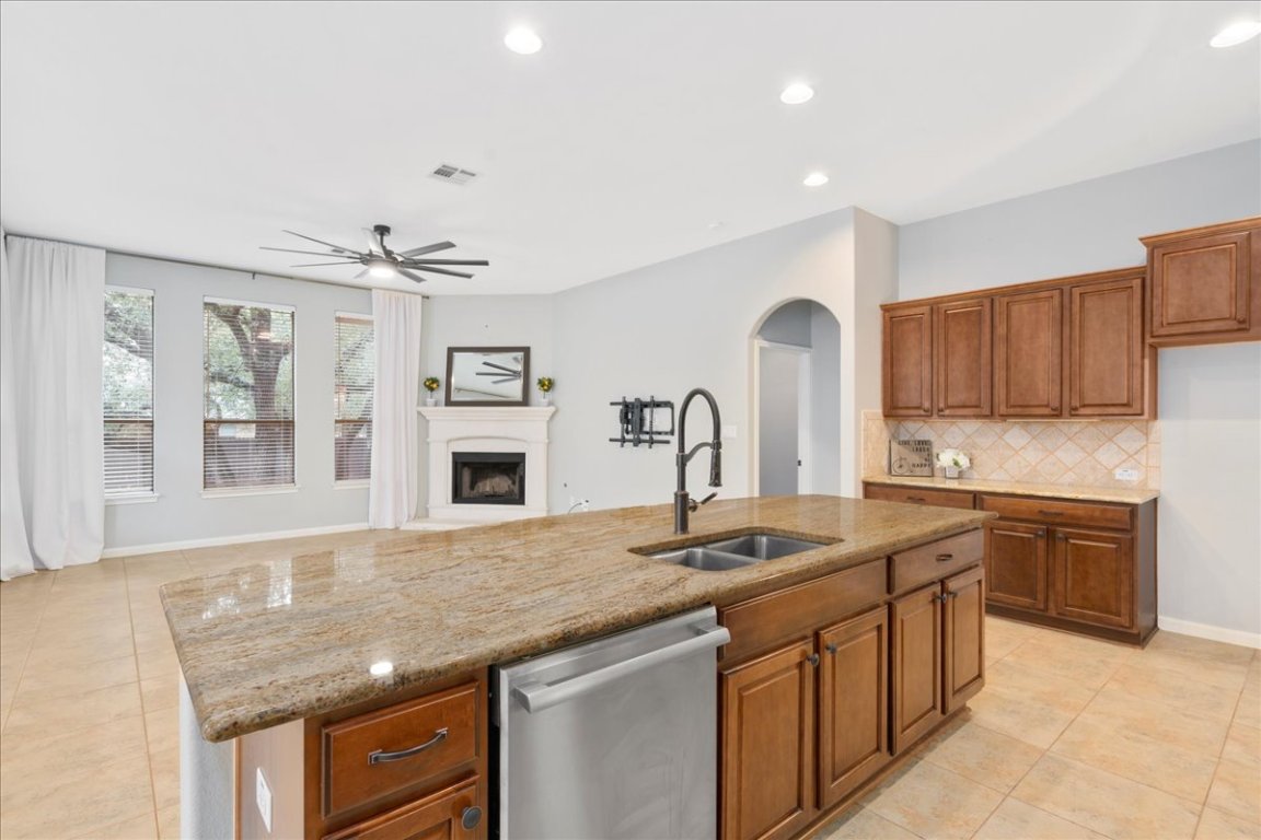 1813 Tall Chief Leander, TX 78641 - Photo 3 of 26 Kitchen featuring visible vents, a sink, light tile patterned floors, and dishwasher