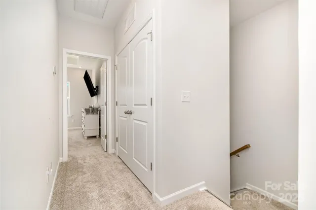 a view of a bathroom from a hallway