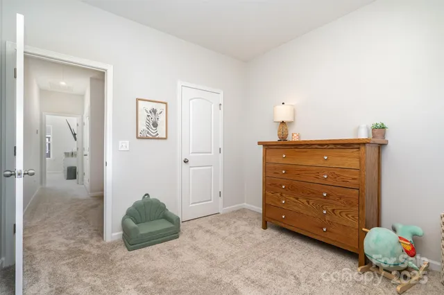 a room with a dresser and a mirror