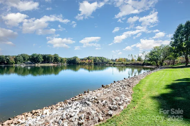 a view of a lake with a bench and lake view