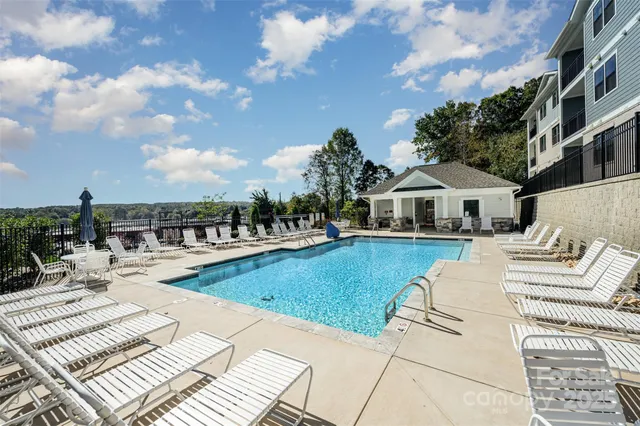a view of a park with iron fence