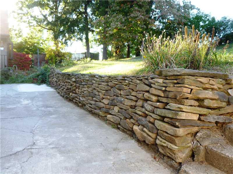 543 Ridge Road Ambridge, PA 15003 - Photo 8 of 23 Patio/Deck. Stone wall on rear patio - Very nice!