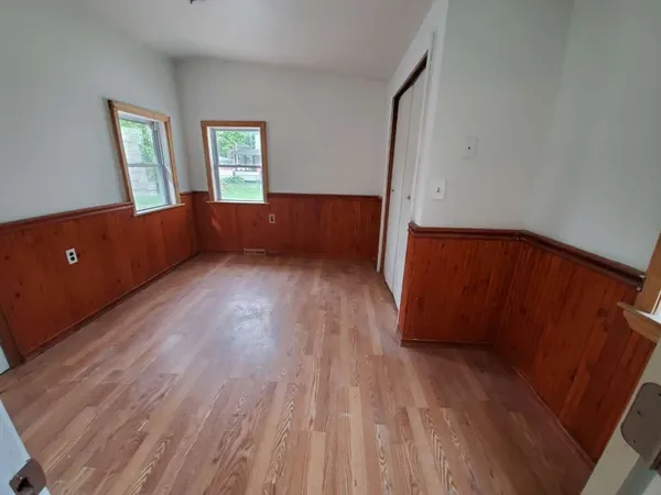 a kitchen with stainless steel appliances granite countertop a stove microwave and refrigerator