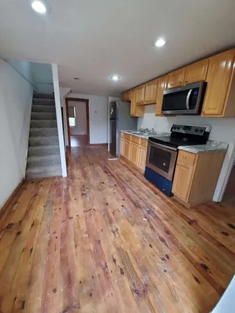 a bathroom with a tub and a shower