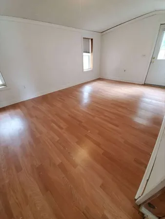 a view of a balcony with sitting area