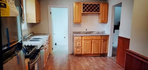 a kitchen with stainless steel appliances granite countertop a stove sink and microwave