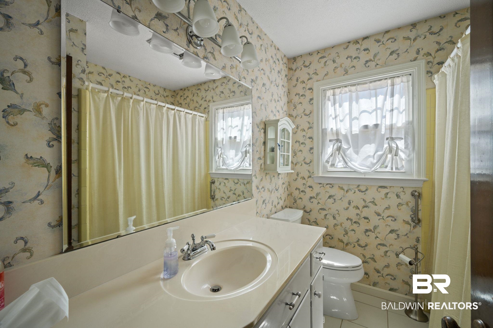 950 Walter Smith Road Mobile, AL 36695 - Photo 18 of 51 Full bathroom with wallpapered walls, toilet, vanity, tile patterned floors, and a shower with shower curtain