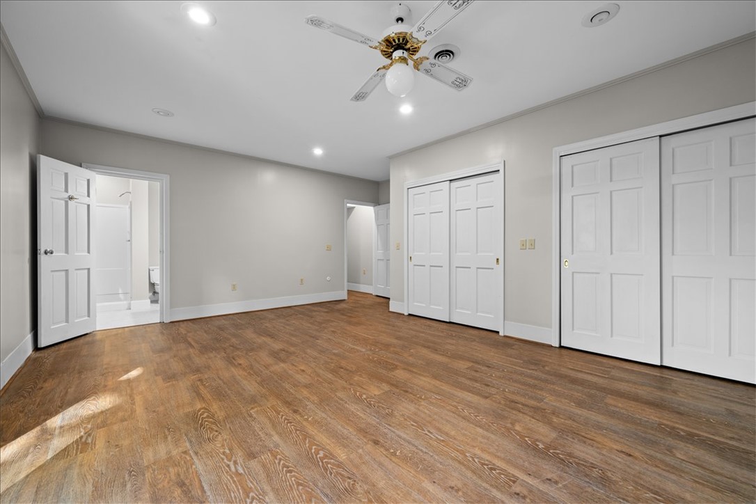 103 Satula Lane Clemson, SC 29631 - Photo 40 of 50 This spacious bedroom features warm hardwood flooring, recessed lighting, and ample closet space.