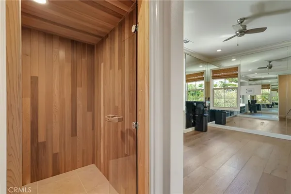 a room with pool table windows and wooden floor