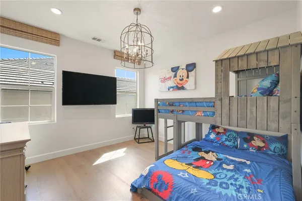a bedroom with a large bed and a couch