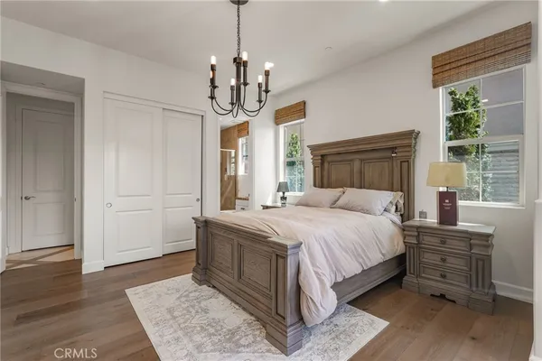 a bathroom with a granite countertop sink toilet a mirror and shower