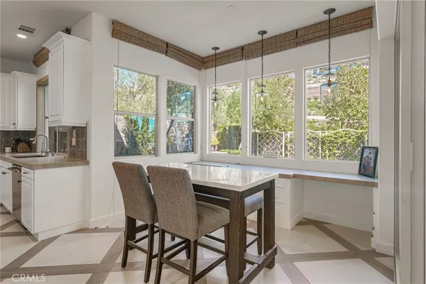 a bedroom with a bed and large window
