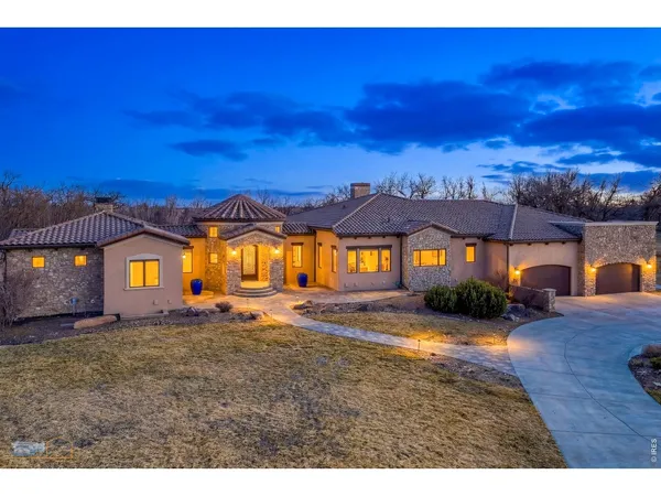 a view of a big house with a big yard