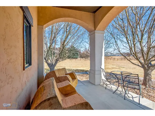 a room with stairs and a ceiling fan