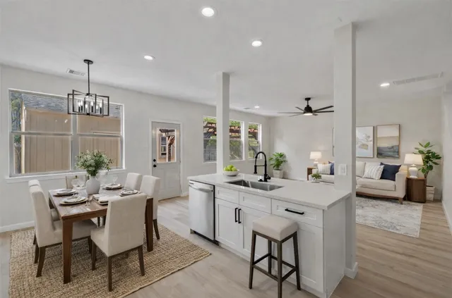 a view of a dining room with furniture window and wooden floor