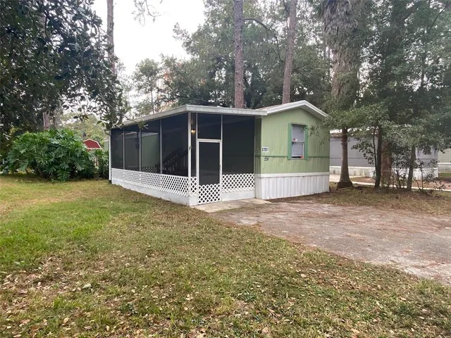 a house with trees in the background
