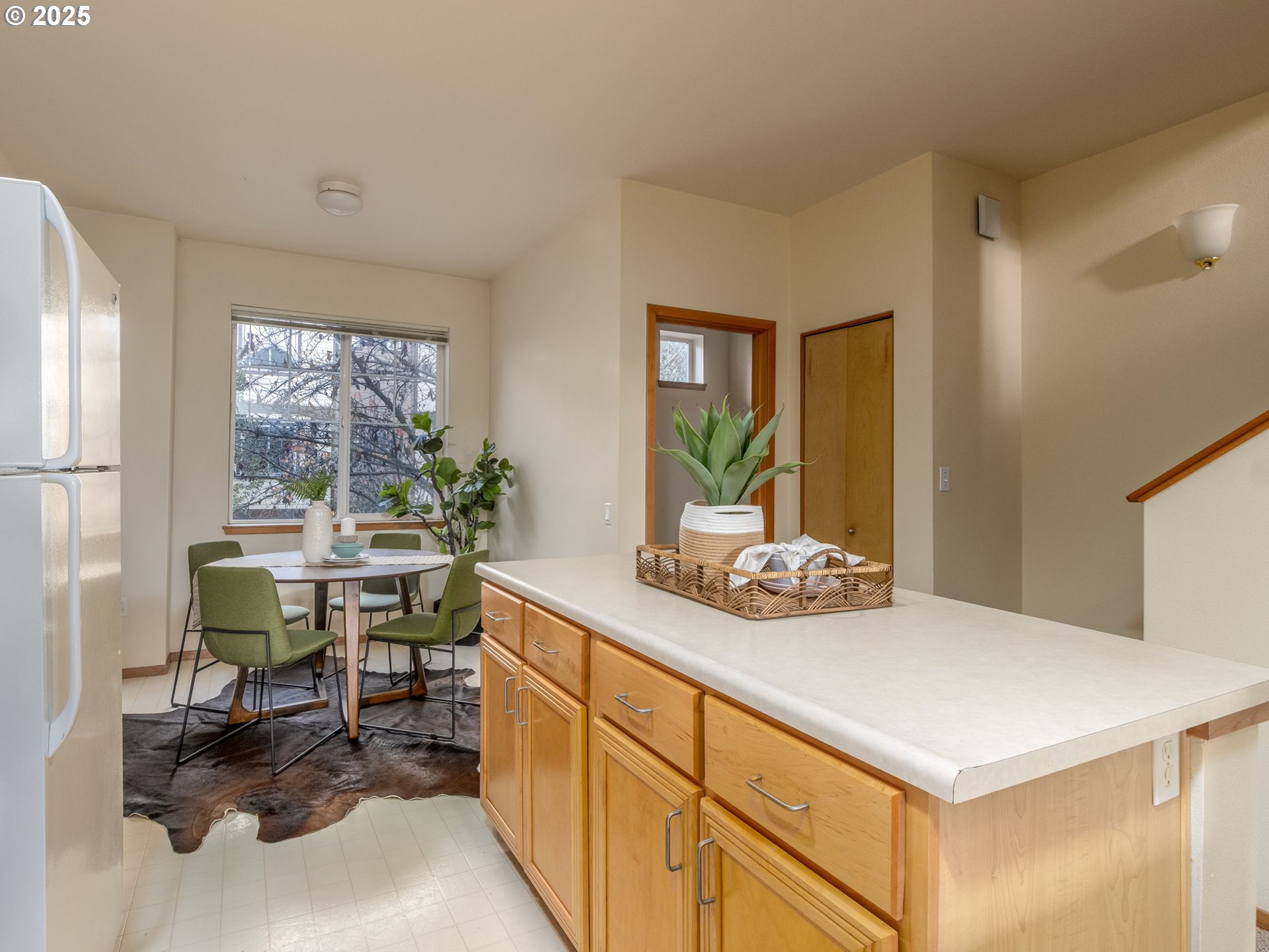 606 Southwest Dillan Drive Beaverton, OR 97006 - Photo 13 of 29 a kitchen with a table and chairs in it