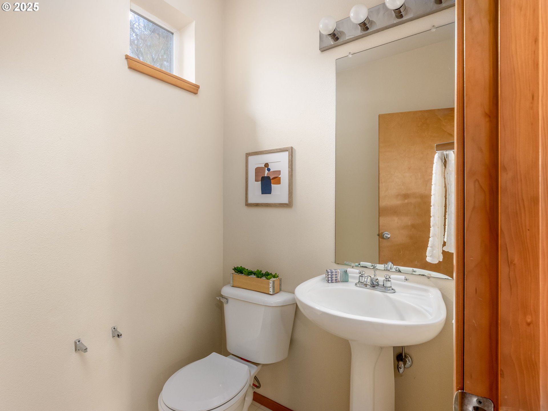 606 Southwest Dillan Drive Beaverton, OR 97006 - Photo 15 of 29 a bathroom with a sink mirror and toilet