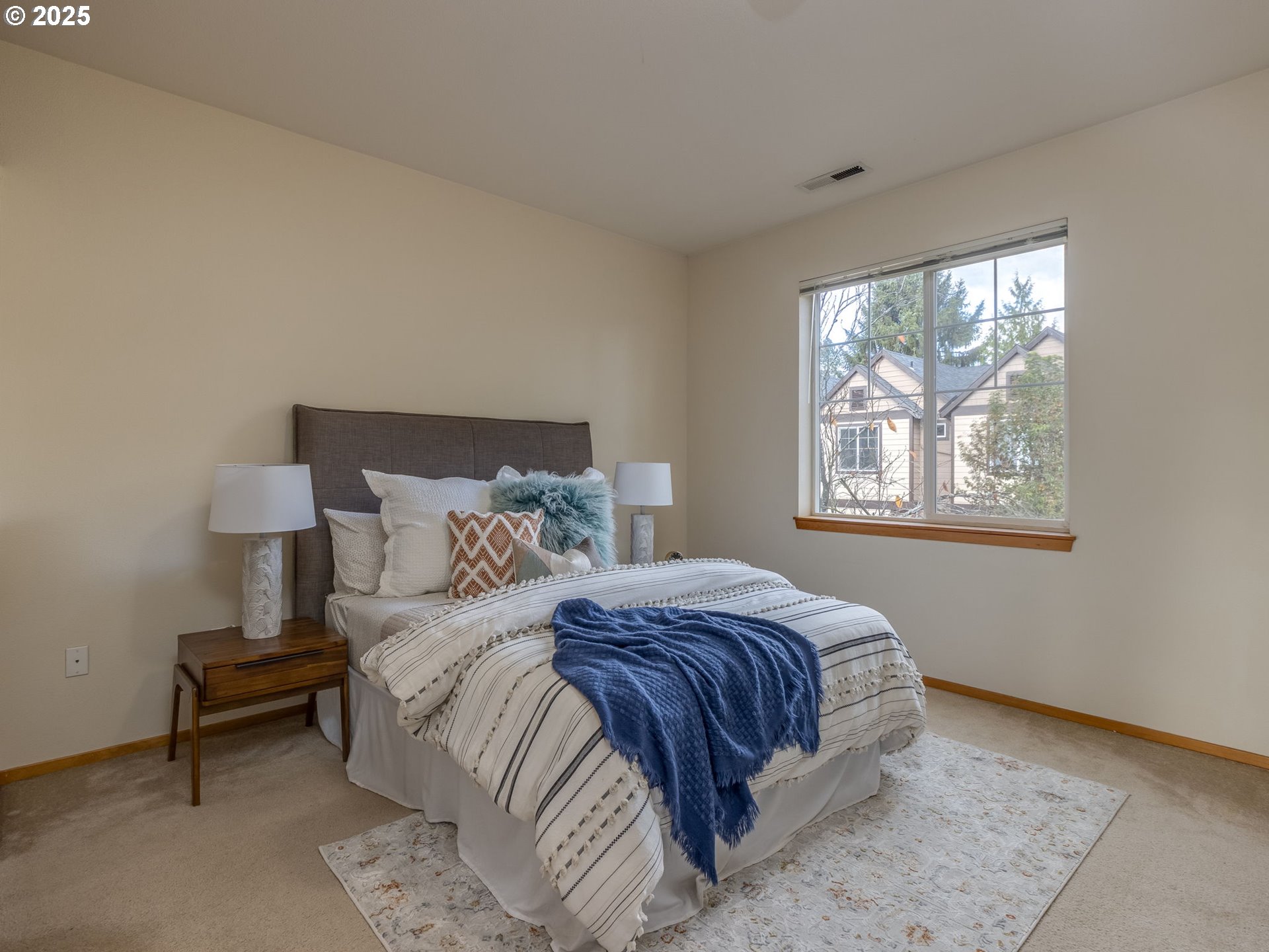 606 Southwest Dillan Drive Beaverton, OR 97006 - Photo 19 of 29 a bedroom with a bed and a window