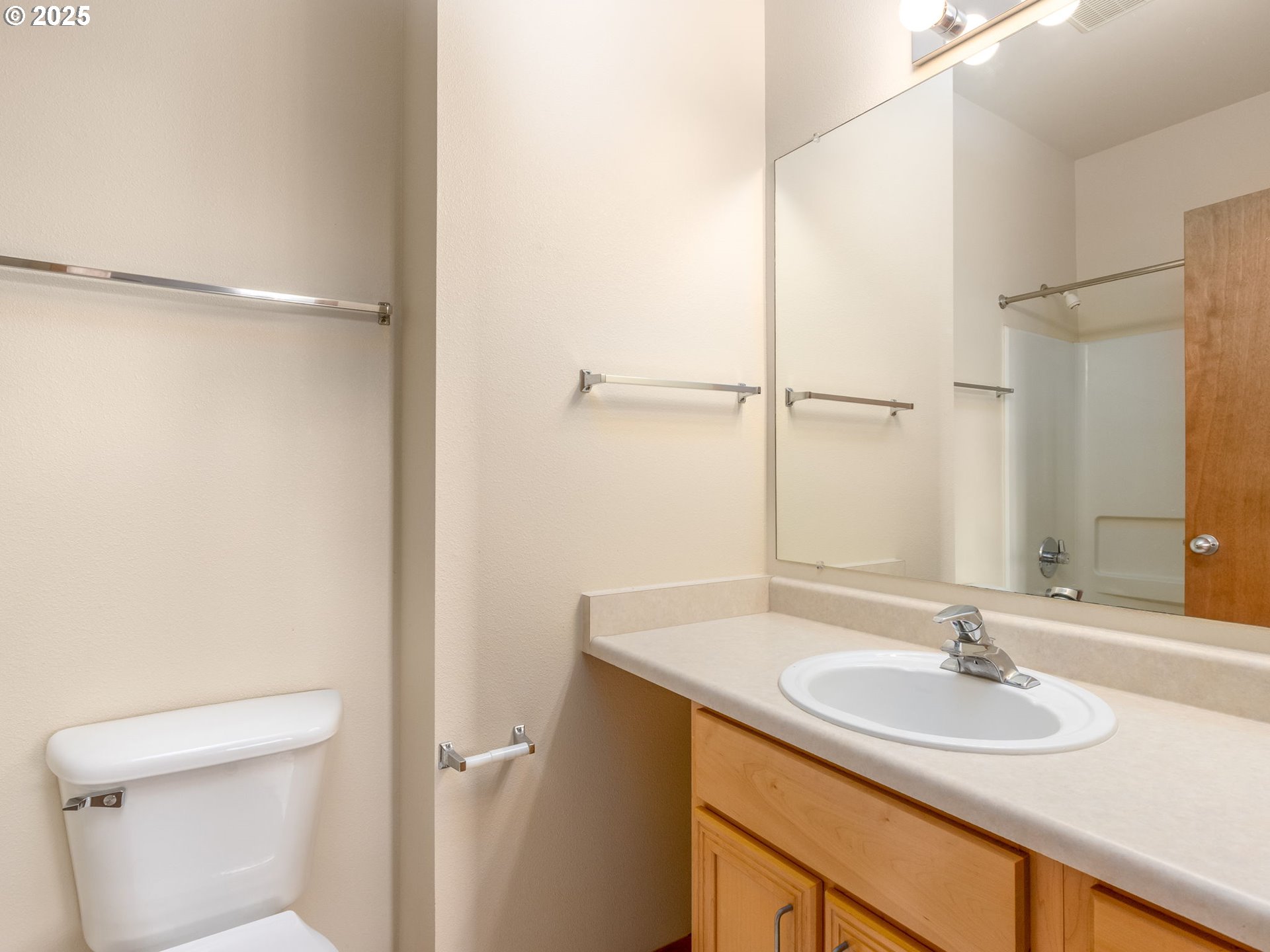 606 Southwest Dillan Drive Beaverton, OR 97006 - Photo 26 of 29 a bathroom with a sink and a mirror