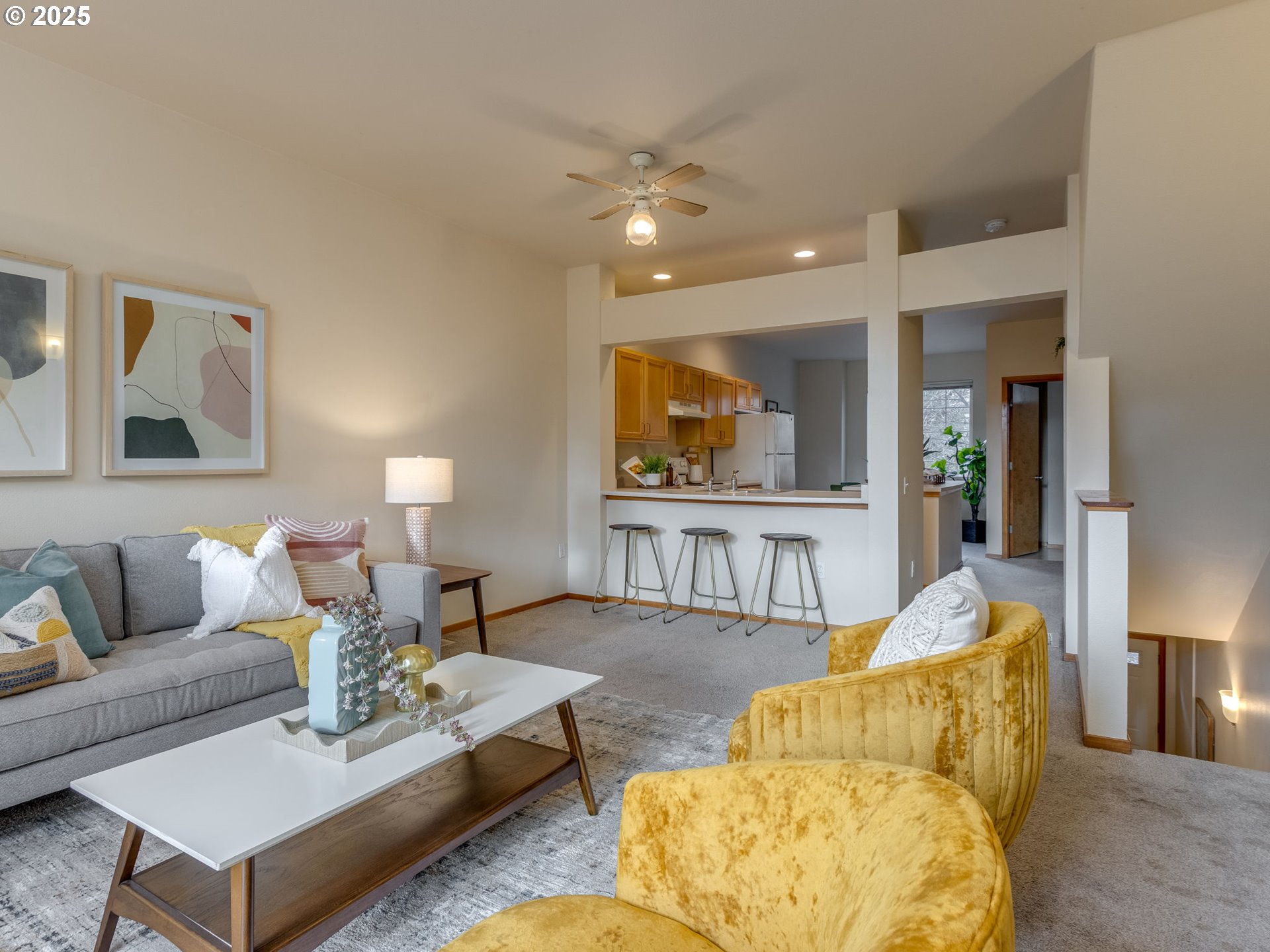 606 Southwest Dillan Drive Beaverton, OR 97006 - Photo 3 of 29 a living room with furniture and painting on the wall