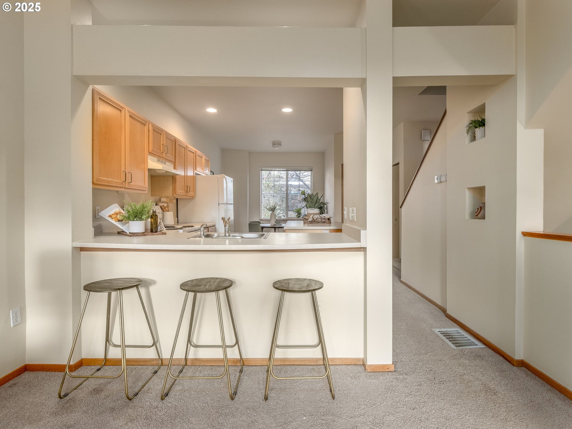 606 Southwest Dillan Drive Beaverton, OR 97006 - Photo 9 of 29 a view of an chairs and a kitchen