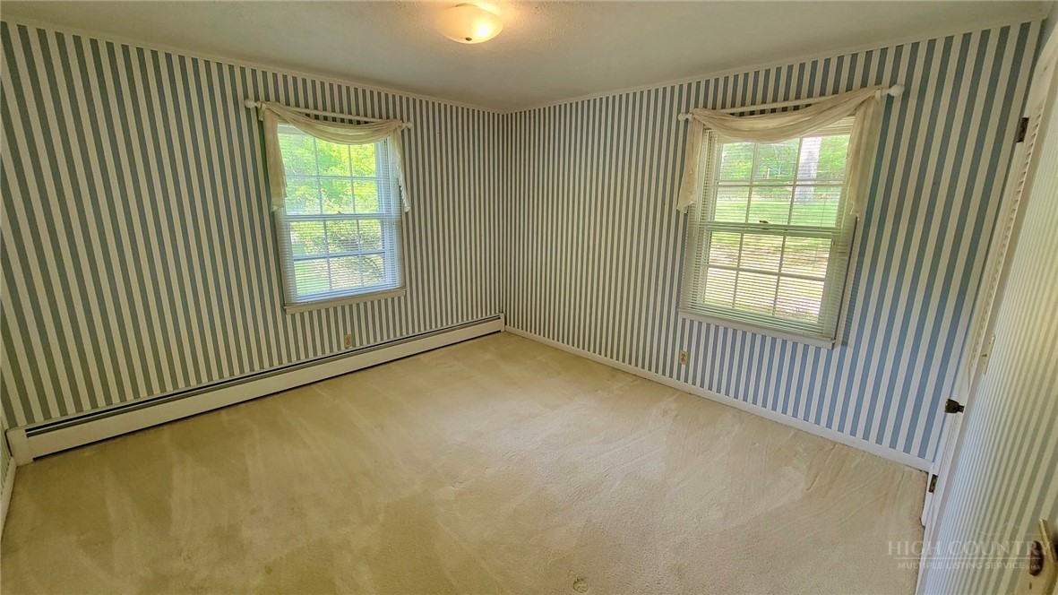 247 Crest Drive Boone, NC 28607 - Photo 12 of 19 a view of an empty room with a window