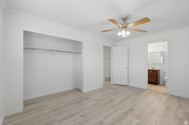 7910 Woolley Way Magna, UT 84044 - Photo 9 of 26 Spacious room featuring light wood-finish flooring, an open closet with a hanging rod, a ceiling fan with light fixture, and crown molding
