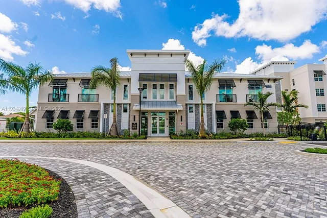 an aerial view of a house with garden space and sitting area