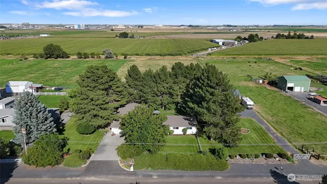 an aerial view of a houses with outdoor space and lake view