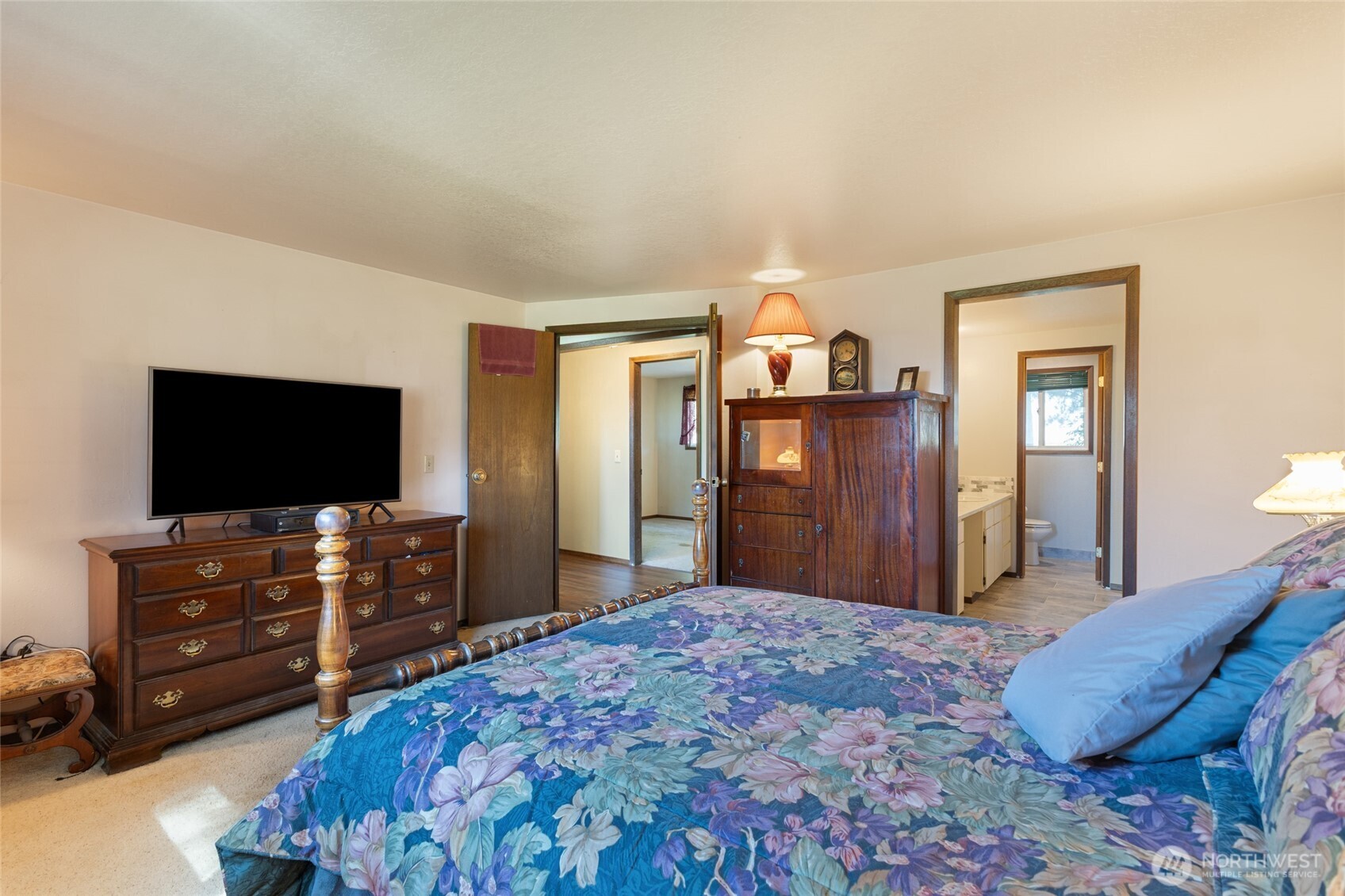 2299 Admiral Road Northeast Moses Lake, WA 98837 - Photo 14 of 40 a bedroom with a bed and a flat screen tv in it