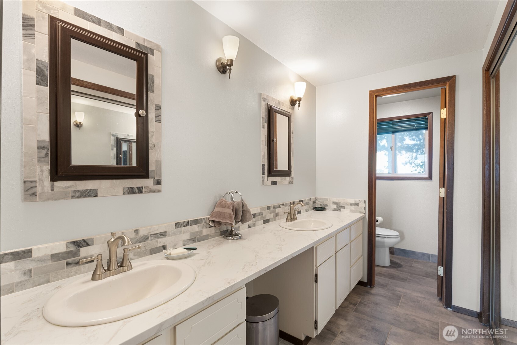 2299 Admiral Road Northeast Moses Lake, WA 98837 - Photo 15 of 40 a bathroom with a double vanity sink and a mirror