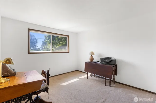 a bathroom with a sink vanity mirror and toilet