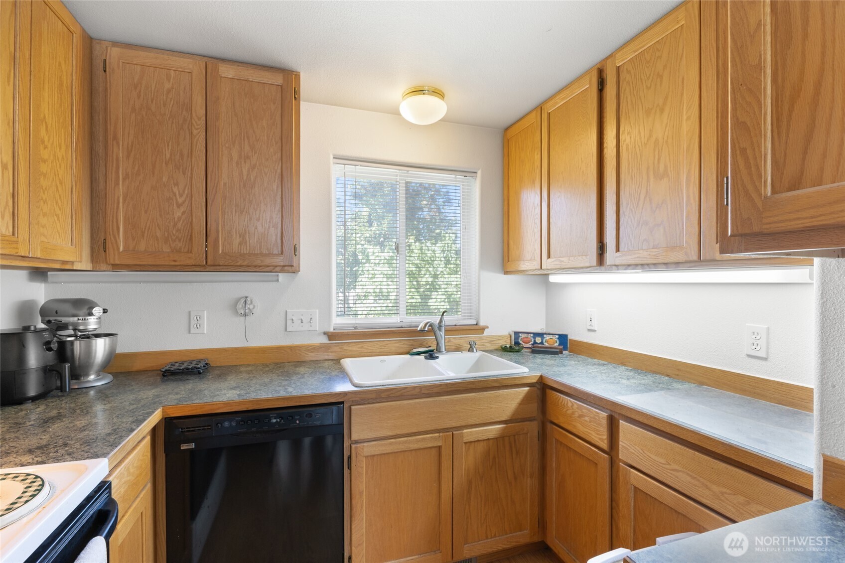 2299 Admiral Road Northeast Moses Lake, WA 98837 - Photo 23 of 40 a kitchen with stainless steel appliances granite countertop a sink a stove and a cabinets