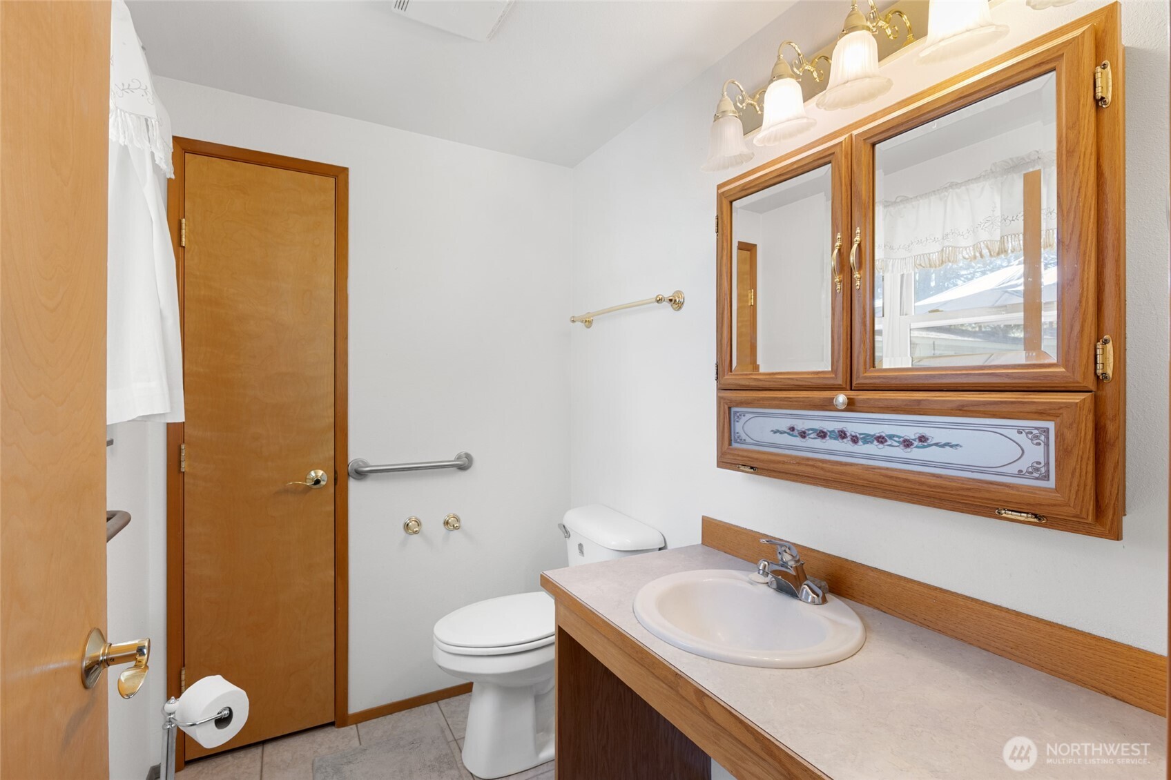 2299 Admiral Road Northeast Moses Lake, WA 98837 - Photo 28 of 40 a bathroom with a granite countertop sink toilet and shower