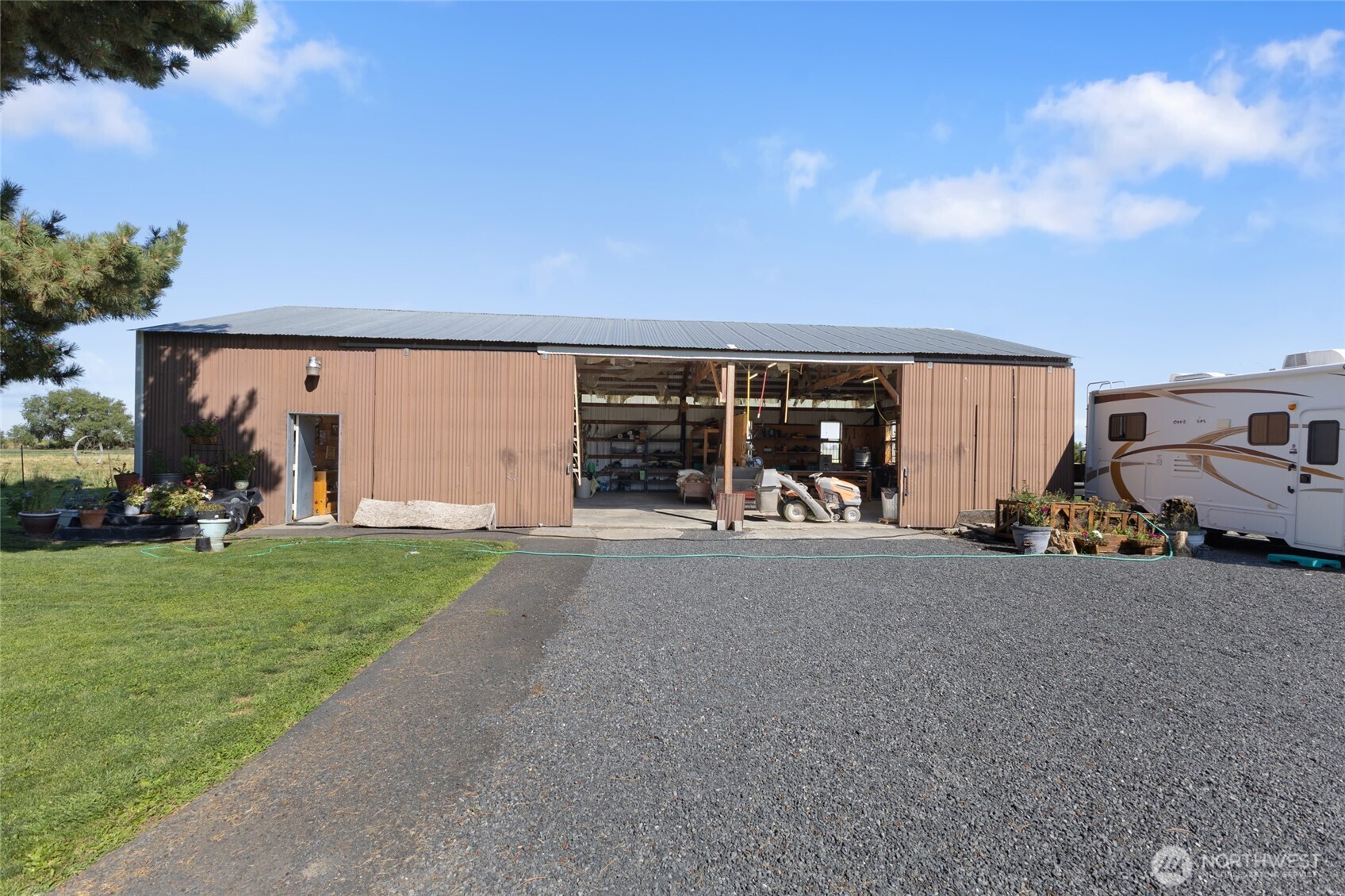 2299 Admiral Road Northeast Moses Lake, WA 98837 - Photo 30 of 40 a view of a house with backyard and porch