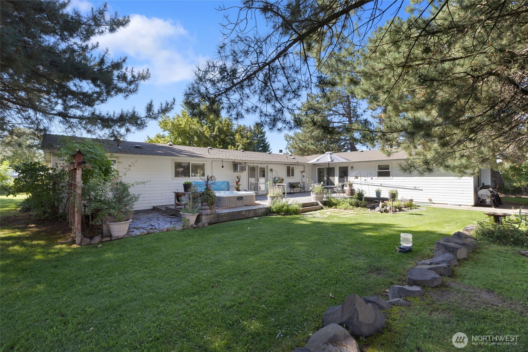 2299 Admiral Road Northeast Moses Lake, WA 98837 - Photo 35 of 40 a view of house with backyard and patio