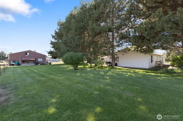 an aerial view of a houses with outdoor space and river