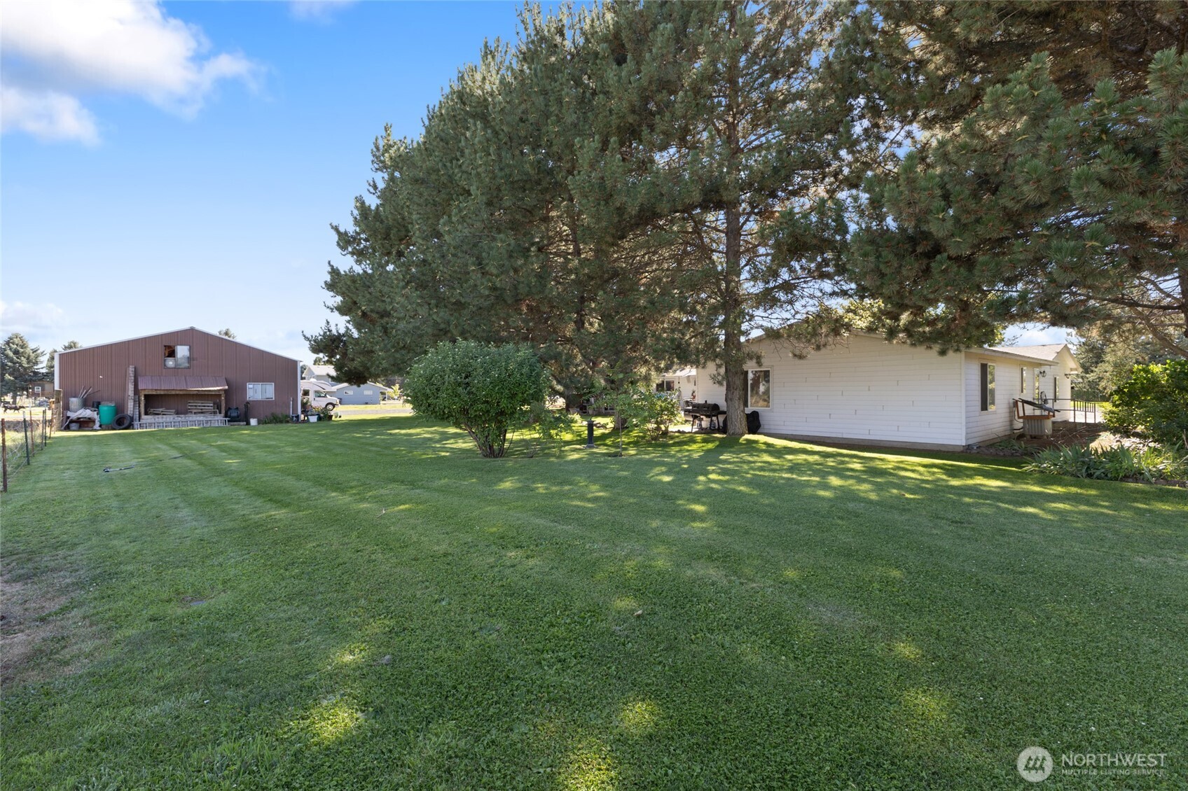 2299 Admiral Road Northeast Moses Lake, WA 98837 - Photo 36 of 40 a view of a house with a yard