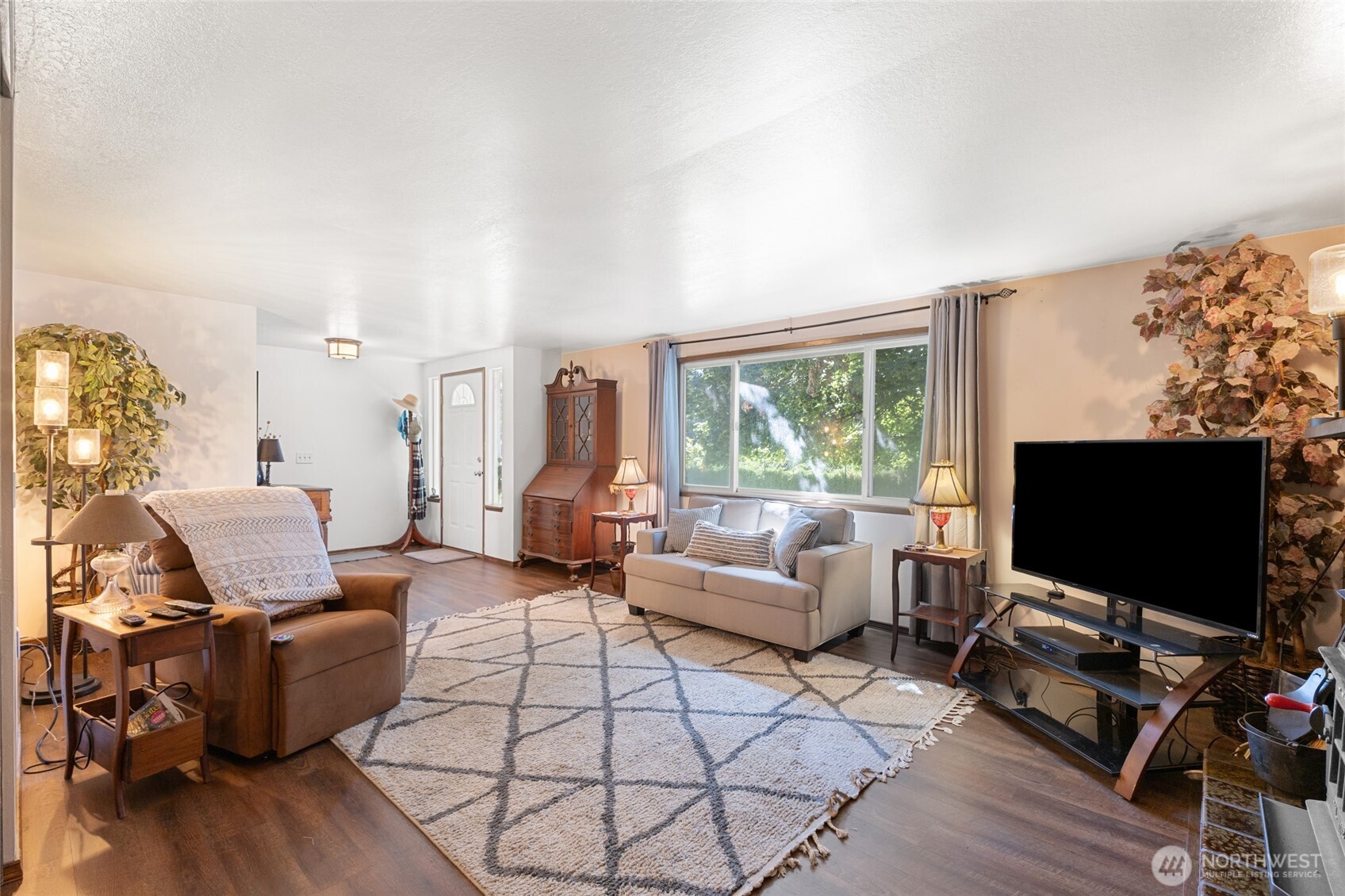 2299 Admiral Road Northeast Moses Lake, WA 98837 - Photo 6 of 40 a living room with furniture and a flat screen tv