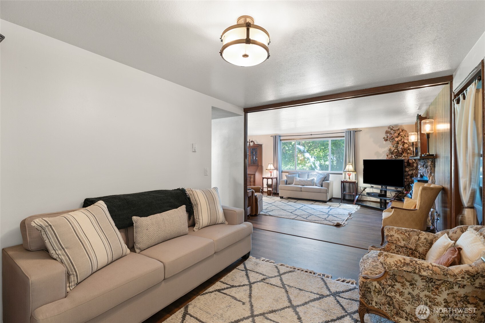 2299 Admiral Road Northeast Moses Lake, WA 98837 - Photo 8 of 40 a living room with furniture and a flat screen tv