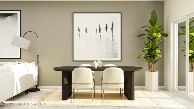 a view of a dining room with furniture and a potted plant