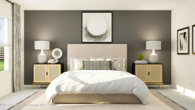 a bedroom with a bed and window